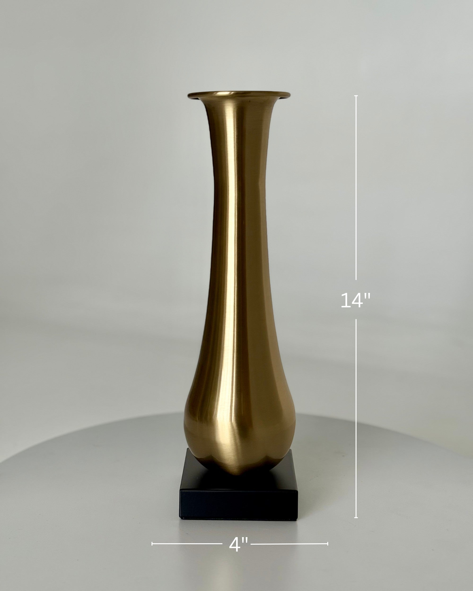 High Objects Eterna Gold Vase, 14-inch tall brushed gold metallic vase with a flared opening on a black square base.