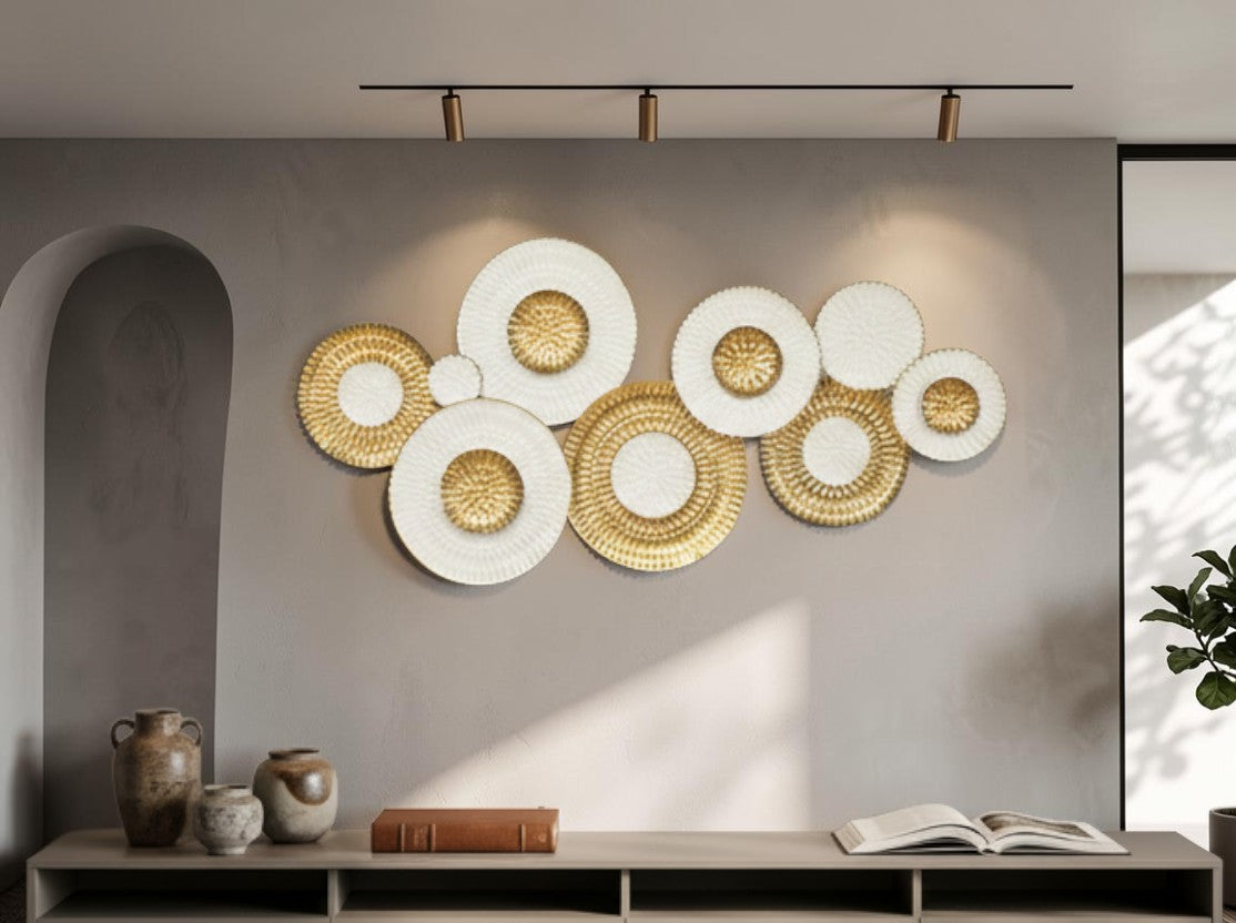 High Objects decorative wall art featuring overlapping white and gold circular textured discs in a modern living room.