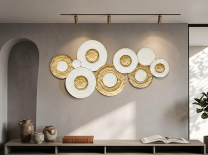 High Objects decorative wall art featuring overlapping white and gold circular textured discs in a modern living room.