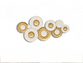 High Objects decorative wall art featuring a cluster of circular white and gold textured metal plates.