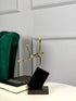 High Objects Golden Balance Artefact, a minimalist gold metal figure balancing on a tilted black block base.