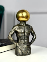 High Objects Golden Mind Showpiece, a textured black polyresin sculpture of a muscular torso with a gleaming gold orb head.