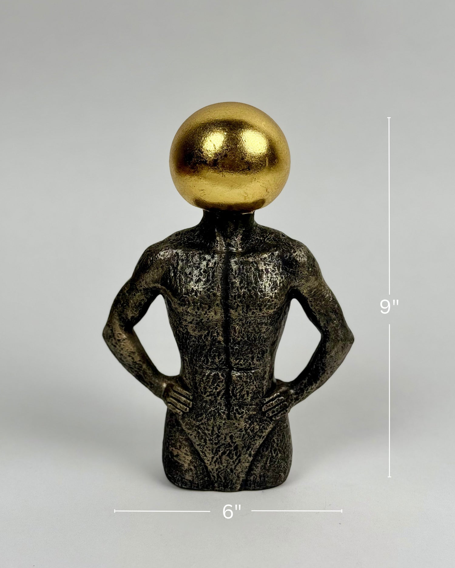 High Objects Golden Mind Showpiece, a 9-inch polyresin sculpture of a muscular torso with a golden orb head, symbolizing intellect and strength.