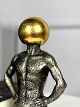 High Objects Golden Mind showpiece, a 9-inch polyresin sculpture of a muscular torso with a textured black finish and a gleaming golden orb head.