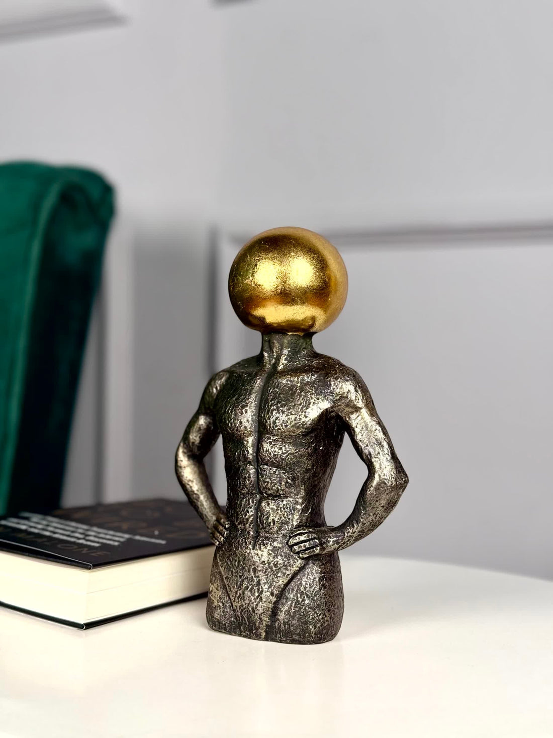 High Objects Golden Mind Showpiece, a textured black polyresin sculpture of a muscular torso with a gleaming gold orb head.