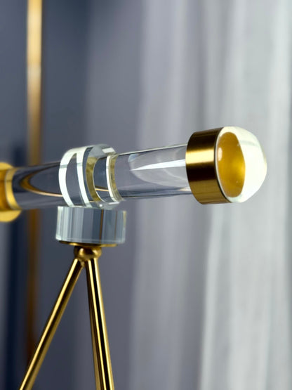 High Objects Golden Navigator Artefact, a modern acrylic and gold telescope-inspired décor piece on a tripod base.