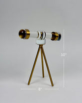 High Objects Golden Navigator Artefact, a 10-inch tall acrylic telescope replica with gold accents on a tripod base.