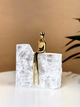High Objects Golden Poise abstract figure sculpture on a natural crystal base, symbolizing elegance and balance.