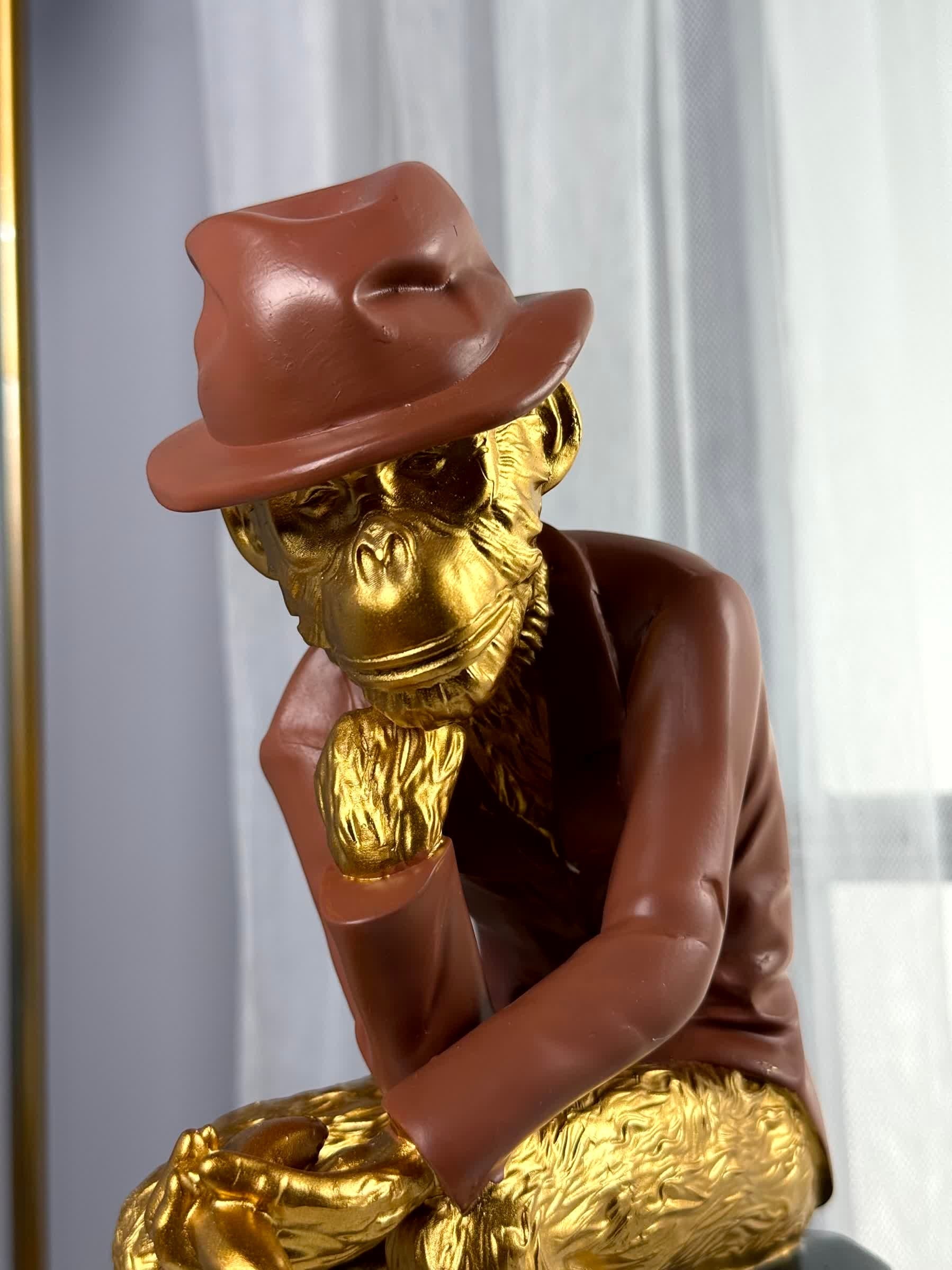 High Objects Golden Thinker Showpiece, a monkey in a brown fedora and suit, gold finish, polyresin, 10-inch tall decorative sculpture.