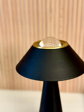 High Objects Halo Noir Table Lamp in matte black with gold accent and clear glass dome top. Minimalist design.