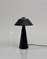 High Objects Halo Noir Table Lamp, matte black conical base with flared shade and gold accent, modern minimalist design.