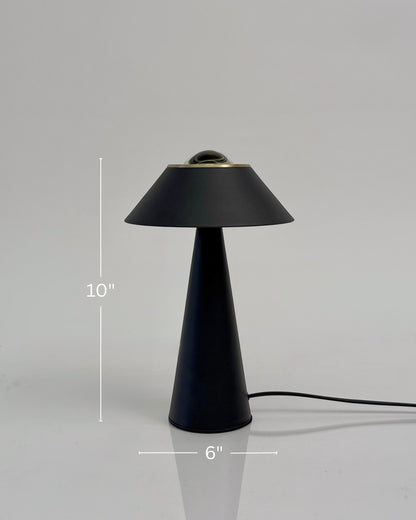 High Objects Halo Noir Table Lamp, matte black conical base with flared shade and gold accent, modern minimalist design.