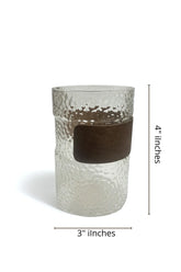 High Objects HALOFORM™ textured clear glass cup with a dark wood band, 4" H x 3" W.