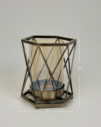 High Objects Hexagrid candle stand with geometric metal frame and amber glass cylinder. Modern decor.