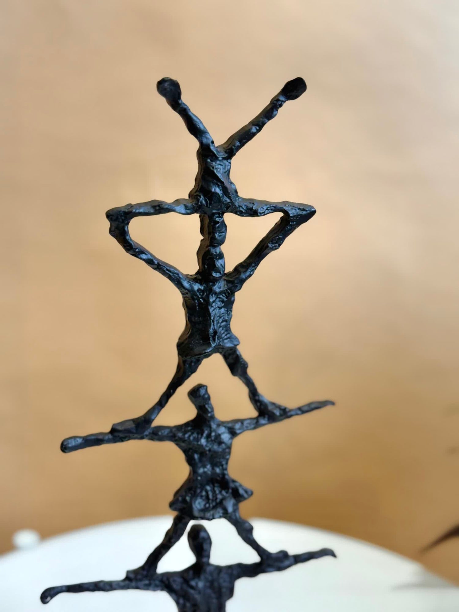High Objects black textured abstract human pyramid artefact sculpture, 14.5 inches tall, symbolizing unity and strength.