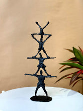 High Objects black textured abstract human pyramid artefact sculpture, 14.5 inches tall, symbolizing unity and strength.