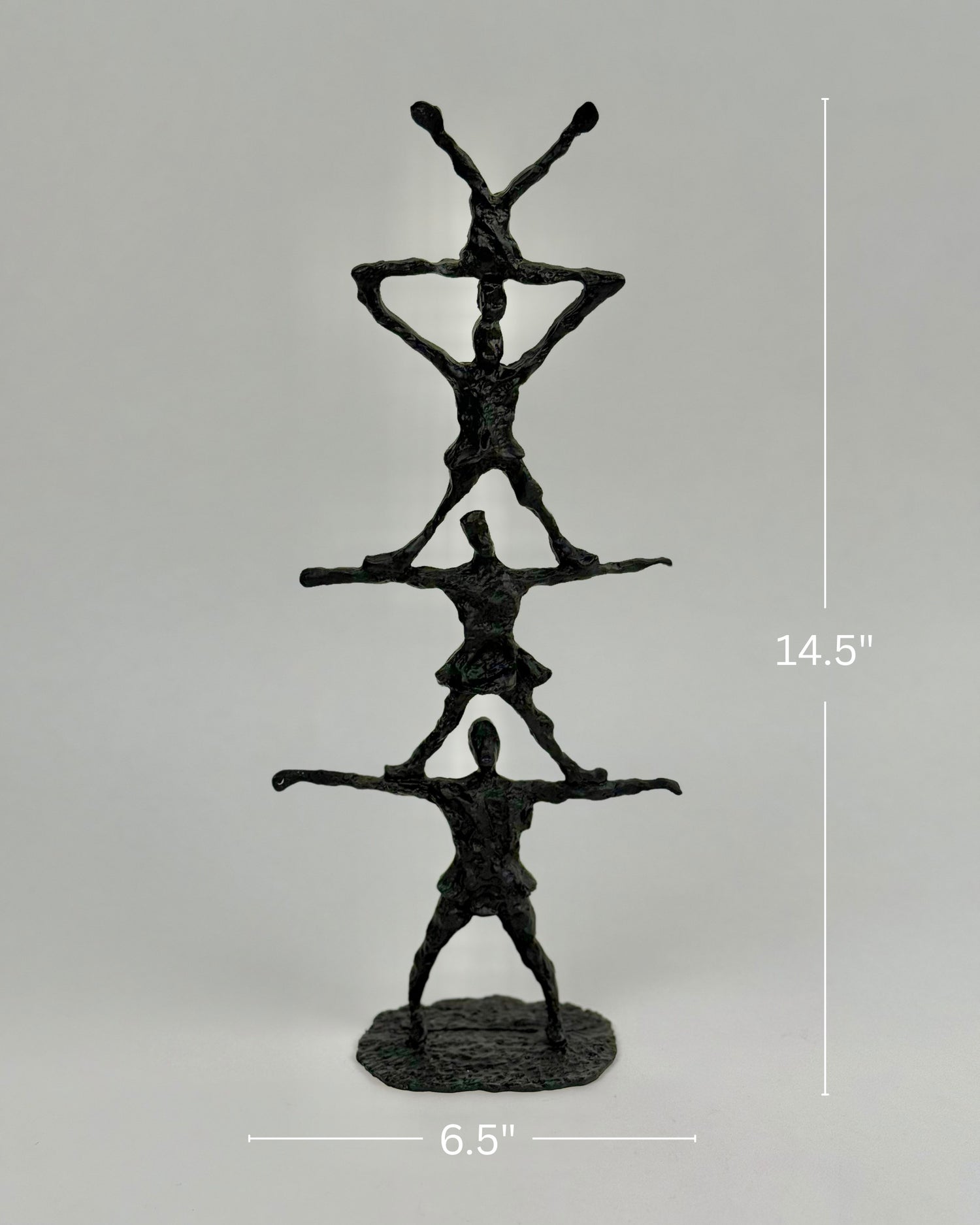 High Objects black textured abstract human pyramid sculpture, 14.5 inches tall, symbolizing unity and strength.