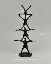 High Objects black textured abstract human pyramid sculpture, 14.5 inches tall, symbolizing unity and strength.