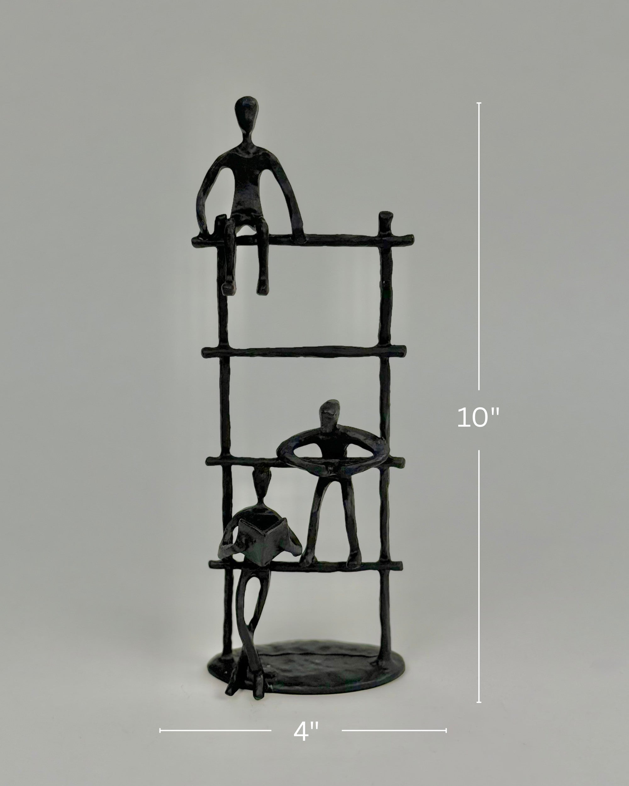 High Objects Journey Ladder Artefact figurine, matte black iron, 10" tall, abstract figures symbolizing progress and support.