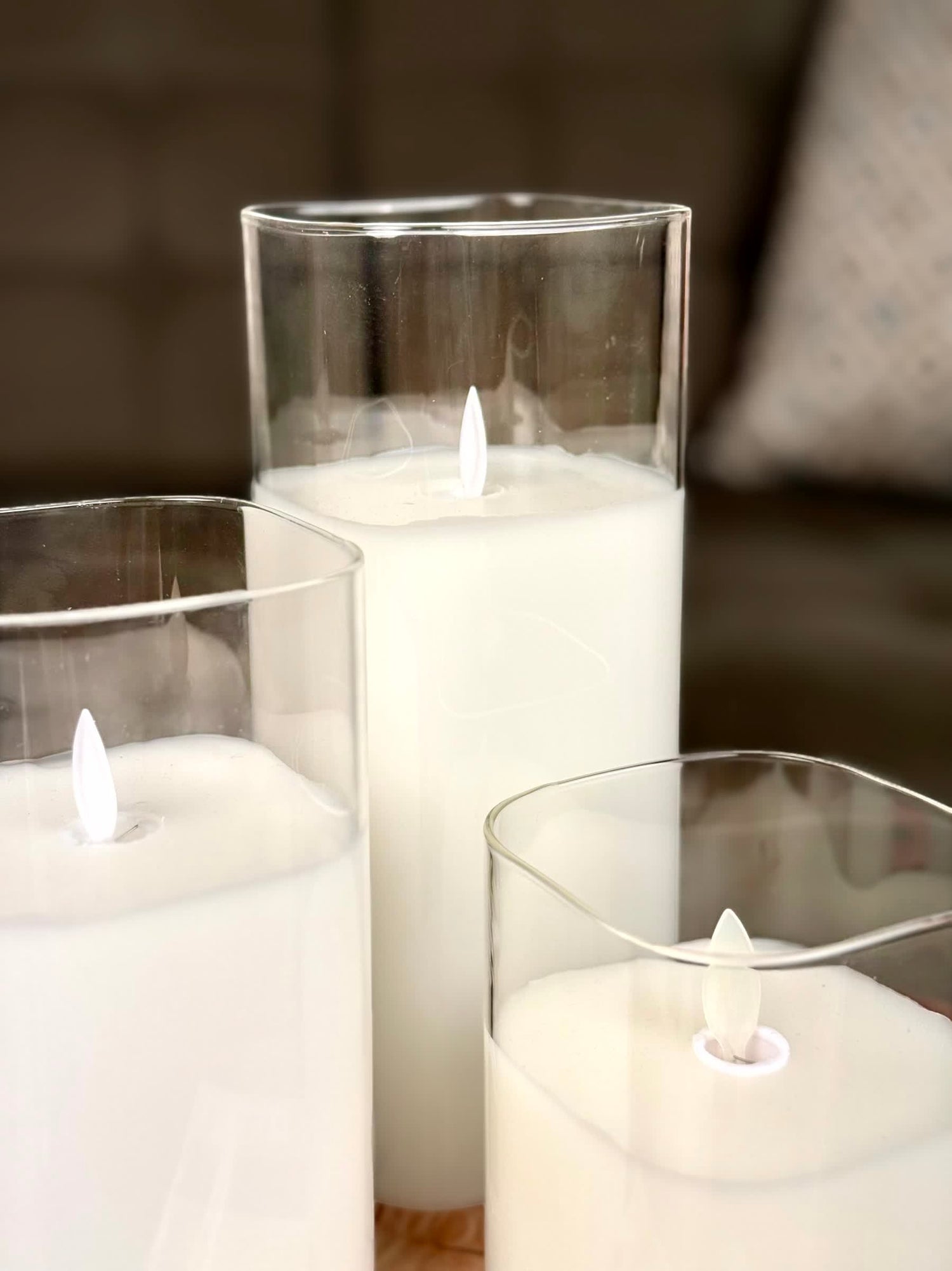 High Objects Halomist LED candles with white wax and clear glass cylinders, flickering LED flames.