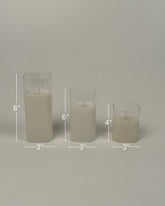 High Objects Halomist LED Candle Collection: Set of 3 ivory pillar candles with clear glass casings, in 8", 6", and 4" heights.