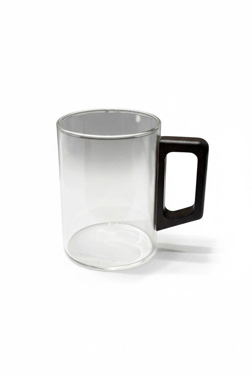 High Objects LINEA glass cup with a squared dark wood handle. Clear cylindrical glass body, heat-resistant.