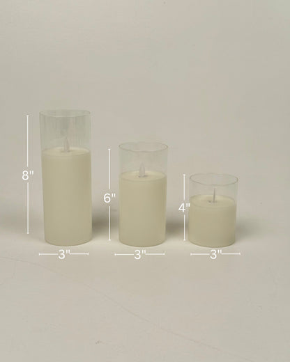 High Objects Lumiglass LED Candle Collection: set of 3 cream pillar candles in glass cylinders, 8", 6", 4" tall.