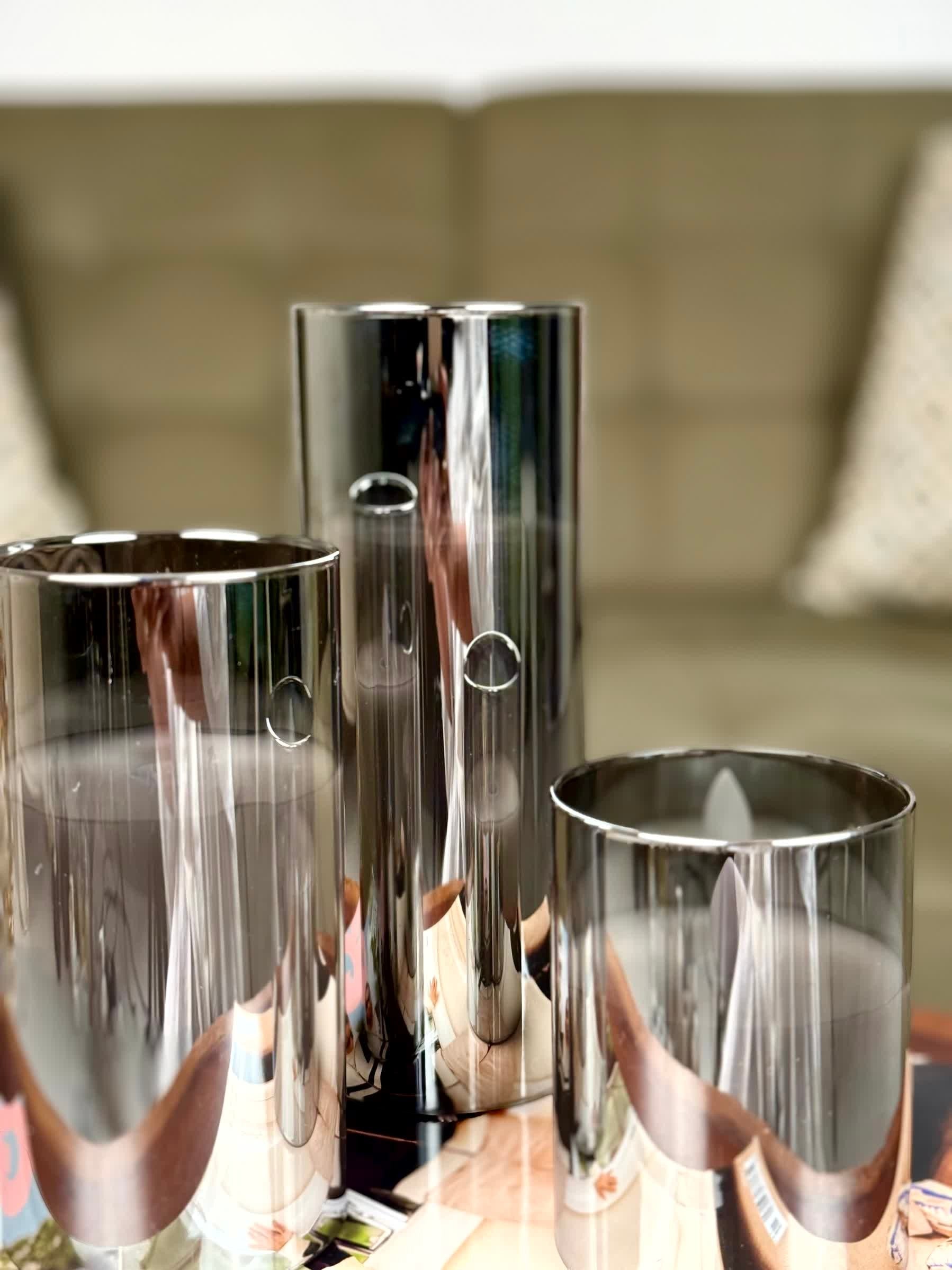 High Objects Lumiglass LED Candle Collection, set of 3 silver glass pillar candles with flickering LED flames.