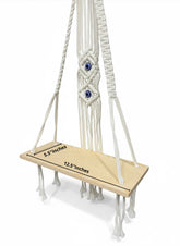 High Objects Zen Series macramé hanging shelf with natural wood board and cream cotton rope, featuring evil eye detail.