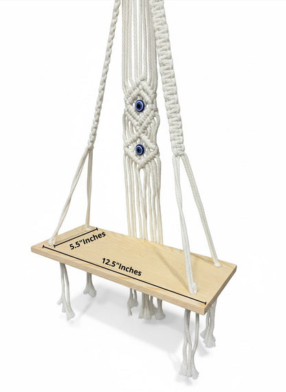 High Objects Zen Series macramé hanging shelf with natural wood board and cream cotton rope, featuring evil eye detail.