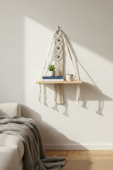 High Objects Zen Series macramé hanging shelf with natural wood board, cream cotton rope, and blue evil eye details.