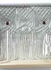 High Objects Ethereal Collection macrame wall shelf with wooden base, cream cotton rope, and decorative wooden beads.
