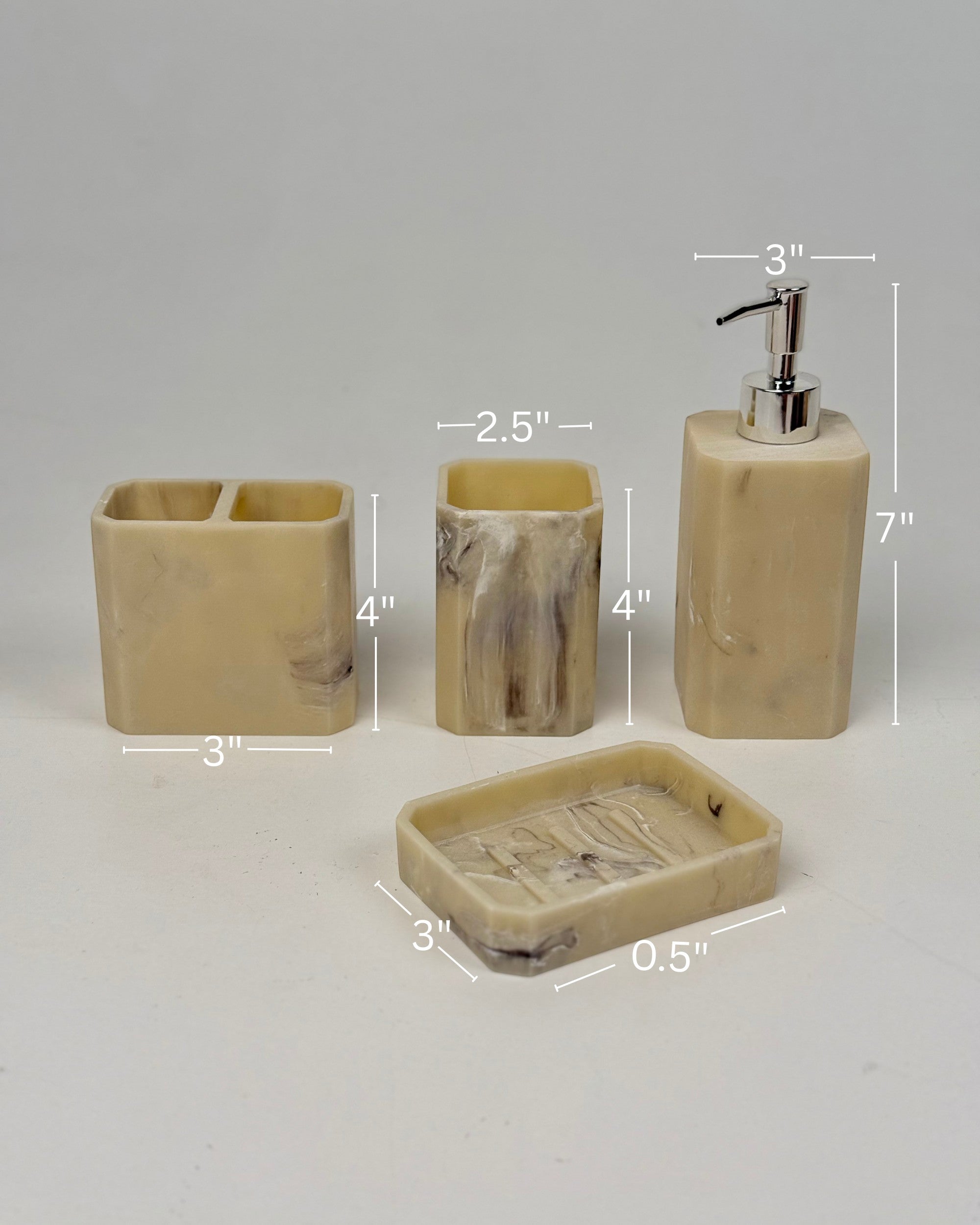 High Objects Marrow Stone Bathroom Accessory Set: soap dish, toothbrush holder, cup, and lotion dispenser in beige with marbled grey details.