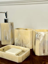 High Objects Marrow Stone Bathroom Accessory Set: lotion dispenser, soap dish, and two tumblers in marbled cream and grey.