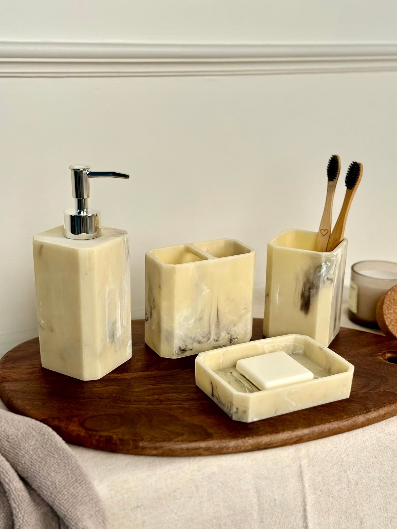 High Objects Marrow Stone Bathroom Accessory Set with soap dispenser, toothbrush holder, and soap dish in marbled cream and grey.