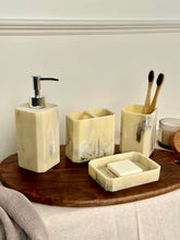 High Objects Marrow Stone Bathroom Accessory Set with soap dispenser, toothbrush holder, and soap dish in marbled cream and grey.