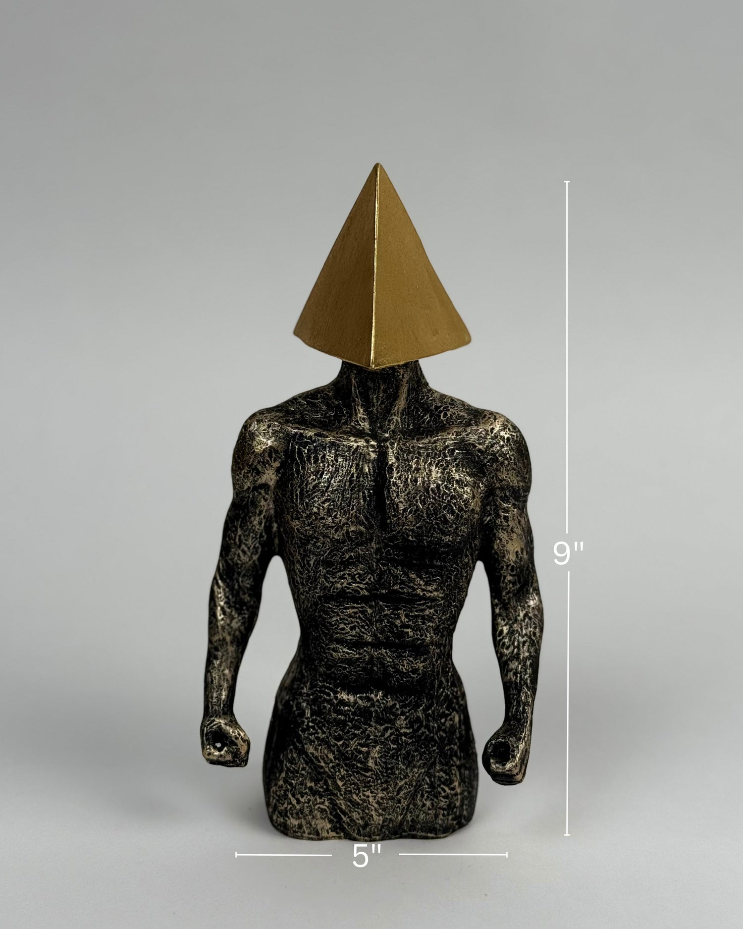 High Objects abstract sculpture of a muscular torso with a gold pyramid head, textured stone finish, 9" tall.