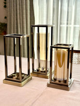 High Objects Modern Halo Frame Candle Stand Set, three metal and glass candle holders in varying heights, bronze finish.