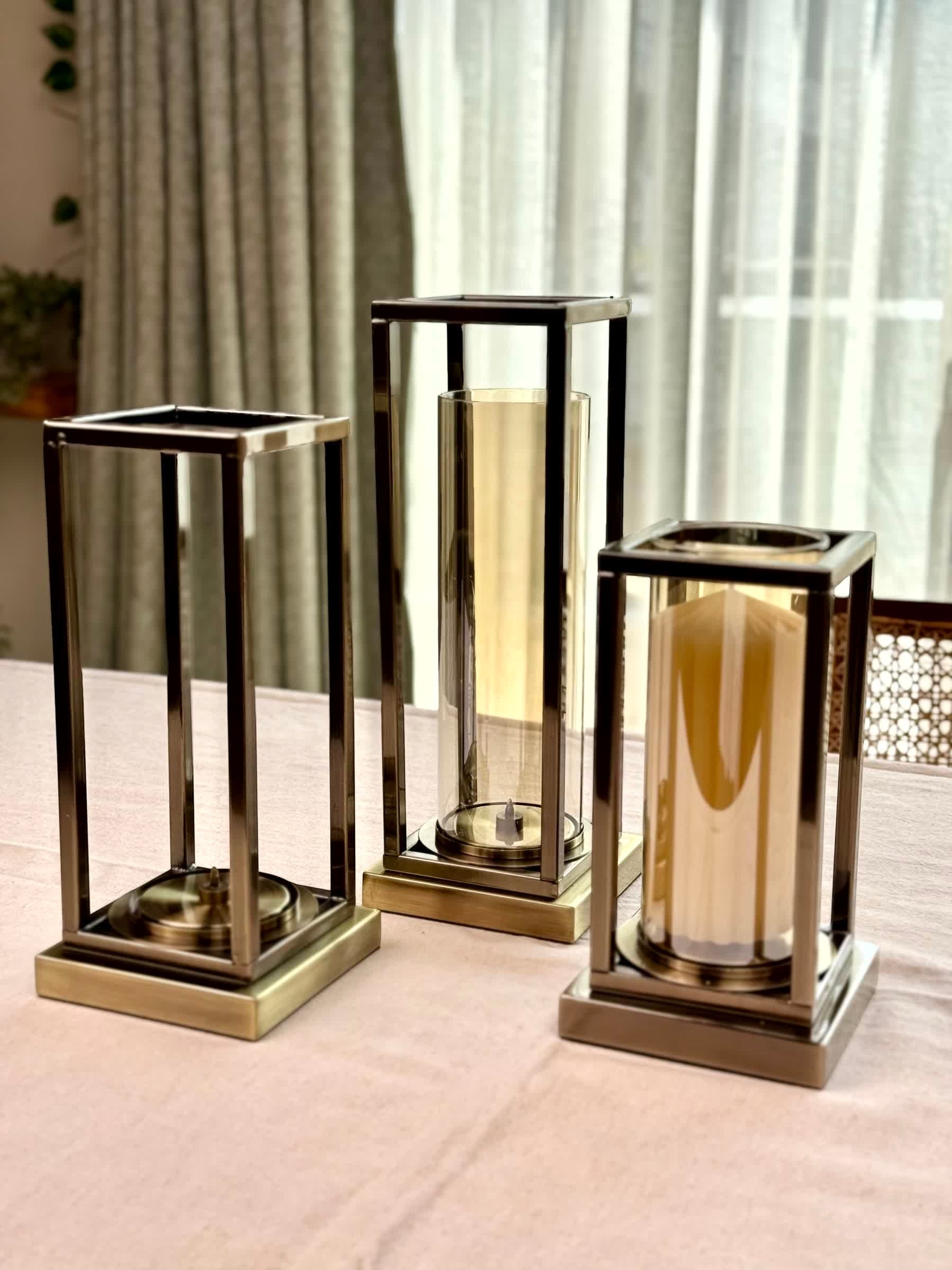 High Objects Modern Halo Frame Candle Stand Set, three metal and glass candle holders in varying heights, bronze finish.