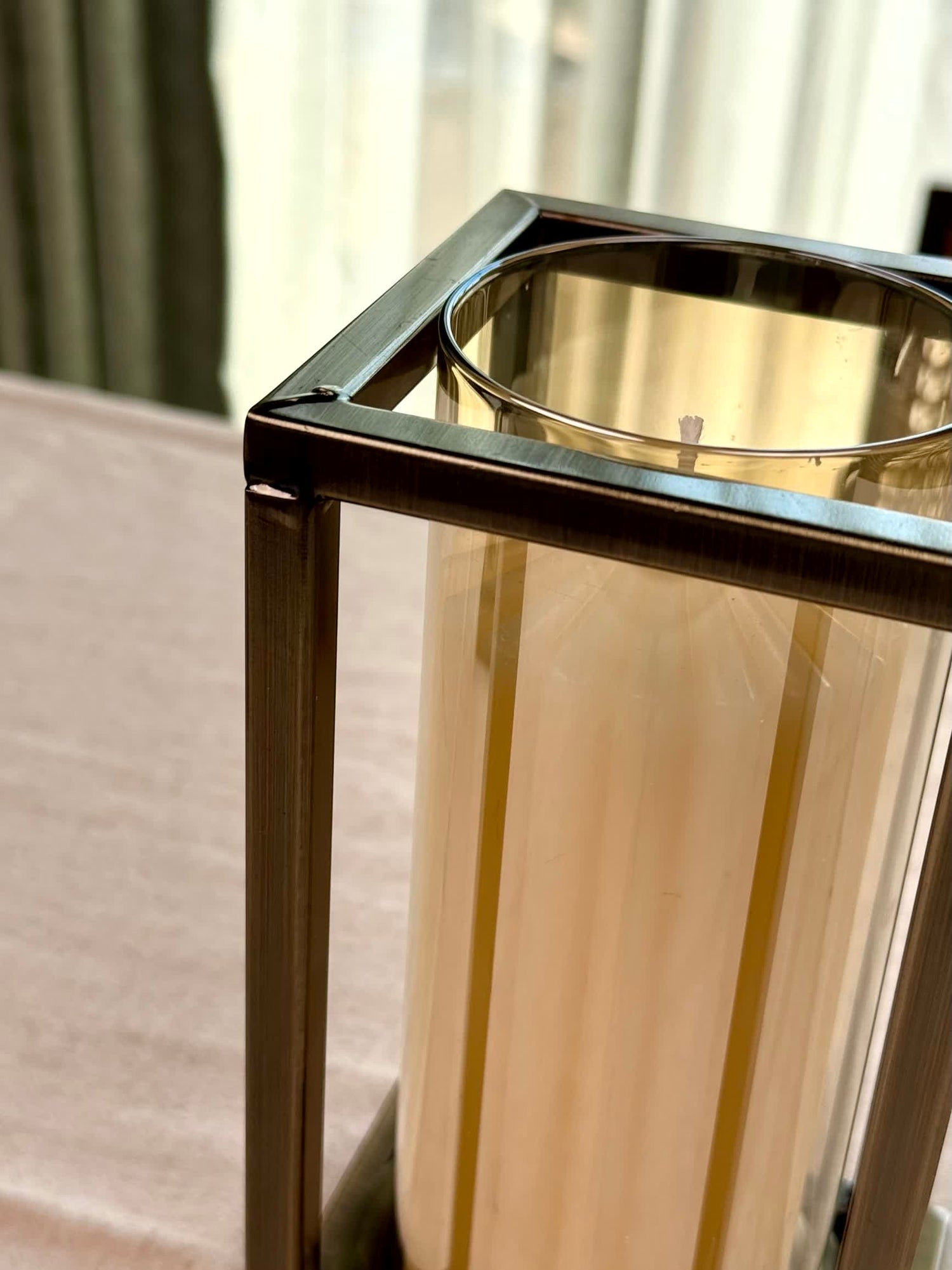 High Objects Modern Halo Frame Candle Stand Set, metal frame with glass cylinder holding a white pillar candle.