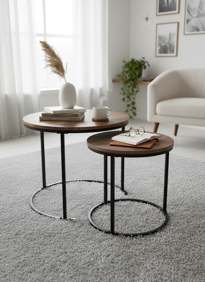 High Objects modern nesting coffee table set with wooden tops and black metal frames. Two round tables, one larger than the other.