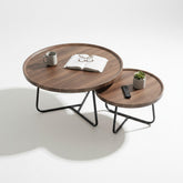 High Objects modern round nesting coffee table set with wooden tops and black metal legs. Includes two sizes for flexible arrangement.