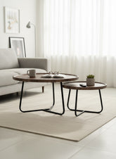 High Objects modern round nesting coffee table set with wooden tops and black metal legs. Includes two sizes for flexible arrangement.