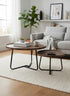 High Objects modern round nesting coffee table set with wooden tops and black metal legs, shown in a living room.