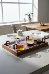High Objects NEXIS glass cups with textured finish and square handles, set of 6, on a wooden tray.