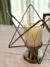 High Objects Nexus Geo candle stand with glass holder and geometric metal frame, antique brass finish.
