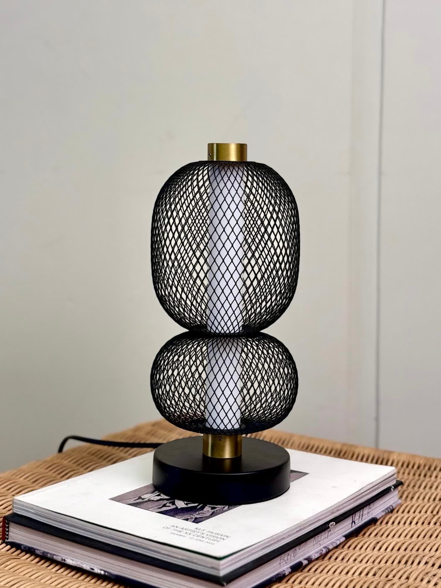 High Objects Nova Mesh Duo Table Lamp with black mesh double sphere silhouette and brushed gold accents.