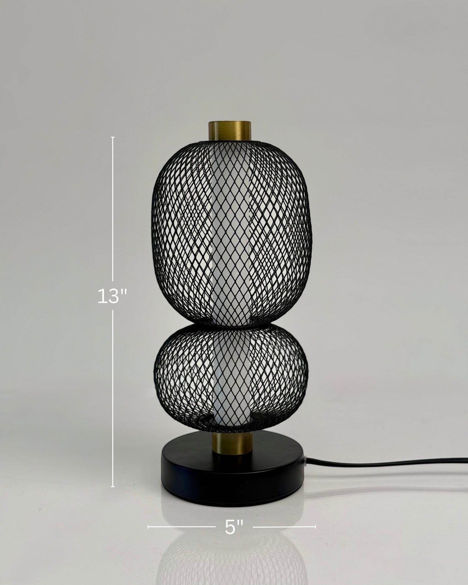 High Objects Nova Mesh Duo Table Lamp, black mesh double sphere design with brushed gold accents and black base.