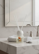 High Objects elegant frosted glass reed diffuser with floral artwork and ocean scent, 50ML.
