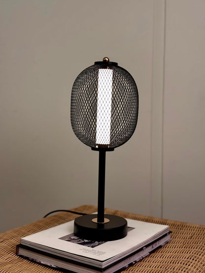 High Objects Orion Mesh Pedestal Table Lamp, black mesh shade with gold accent, modern design.